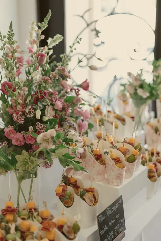 Charcuterie cones beside snapdragons & lisianthus