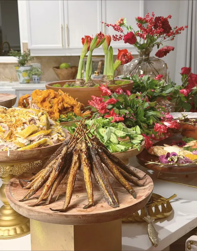Family-style banquet — grilled fish skewers, chicken salad & amaryllis